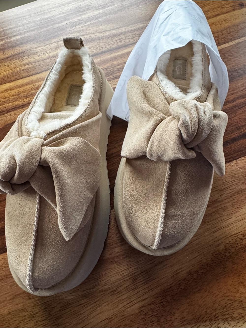 UGG Bow-Accent Slip-On Platforms in Sand/Beige